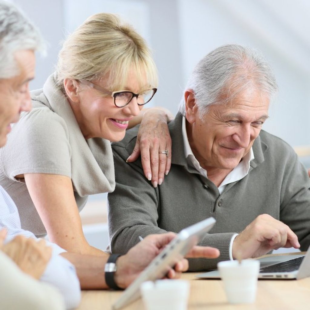 People checking something on laptop