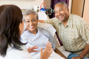 older woman consults with her doctor on HRT