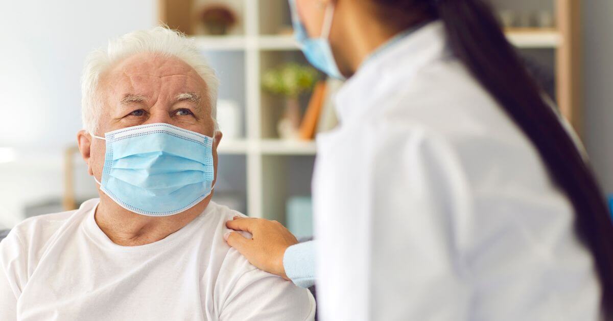 Doctor Visiting Senior Patient during Period of Seasonal Infection or Covid 19 Pandemic