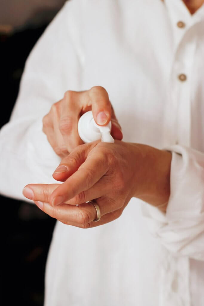 Person administering prescription hand cream