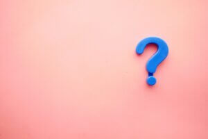 blue question mark on pink background