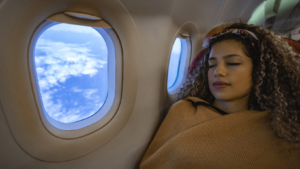 woman sleeping on airplane