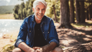 man sitting outdoors enjoying life