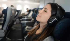 Woman traveling by plane and sleeping