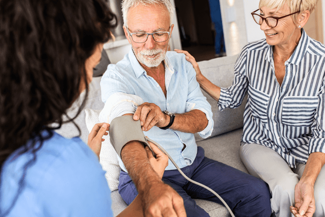 man measuring his blood pressure