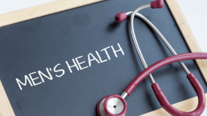 Stethoscope next to a chalk board with the words Men's Health