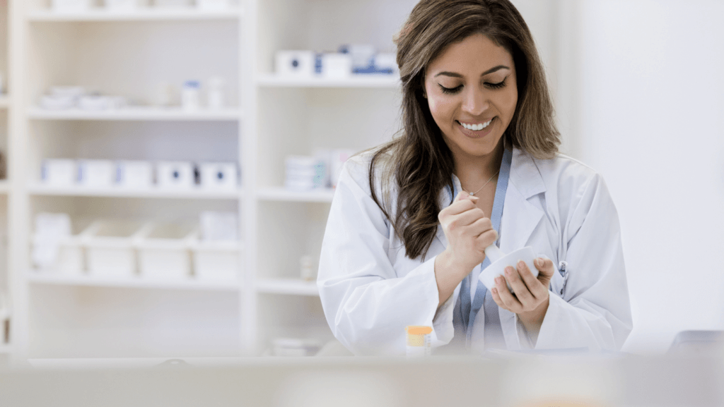 Cheerful pharmacist working in a compounding pharmacy