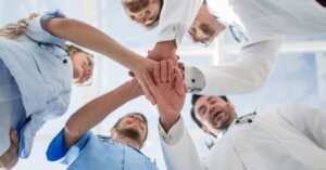 Medical Workers Stacking Hands