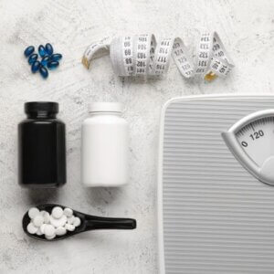 Weight Loss Pills, Scales and Measuring Tape