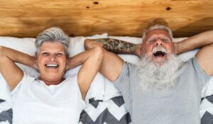 Happy Senior Couple in Bed