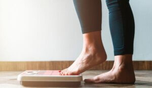 Person Stepping into a Bathroom Scale