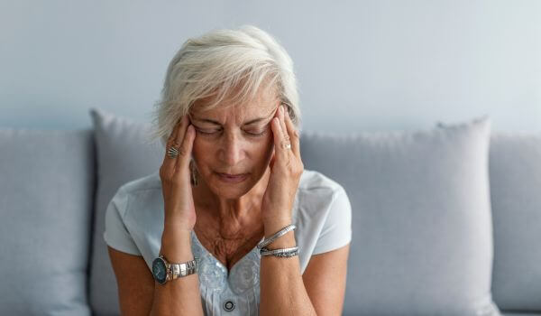 Woman having headache migraine