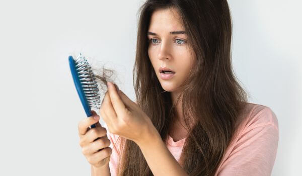 Young Woman Is Upset Because of Hair Loss