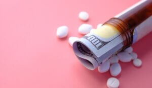 Healthcare cost concept with us dollar in container