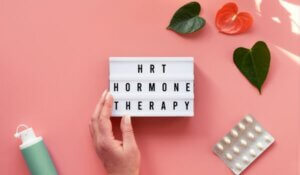 Text HRT Replacement on Light Box. Menopause, Hormone Concept.