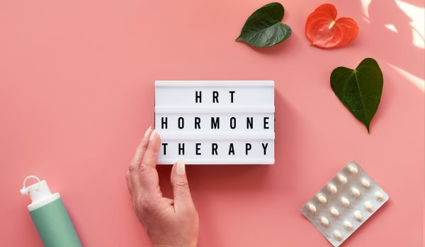 Text HRT Replacement on Light Box. Menopause, Hormone Concept.