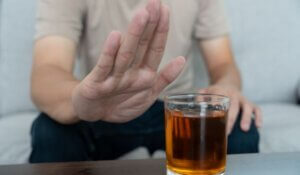 Addictive Behavior: Man Refuses to Drink Alcohol Whiskey 