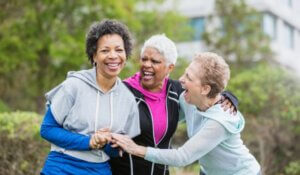 Three older multi-ethnic women hanging out together