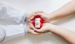 Entresto on Doctor and Patient Holding a Heart Up Close