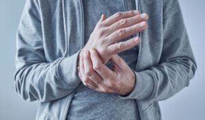 Rheumatoid arthritis, man suffering from severe pain in wrist