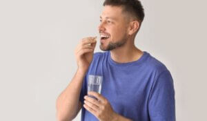 Man taking vitamin supplement