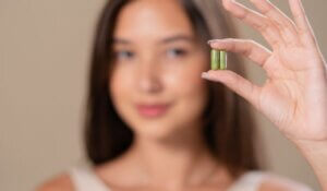 Portrait of Woman with Capsule Supplement