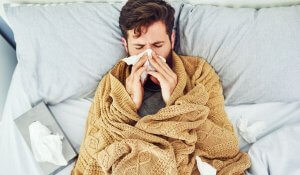 man with flu symptoms