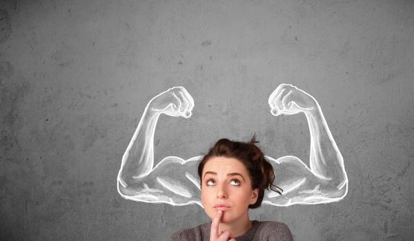 Young woman with strong muscled arms