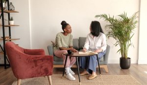Woman discussing treatment options with her physician