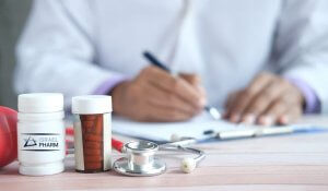 Close up shot of doctor prescribing medication