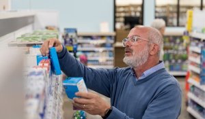 Comparing generic and brand name medications that are offered by the pharmacy.